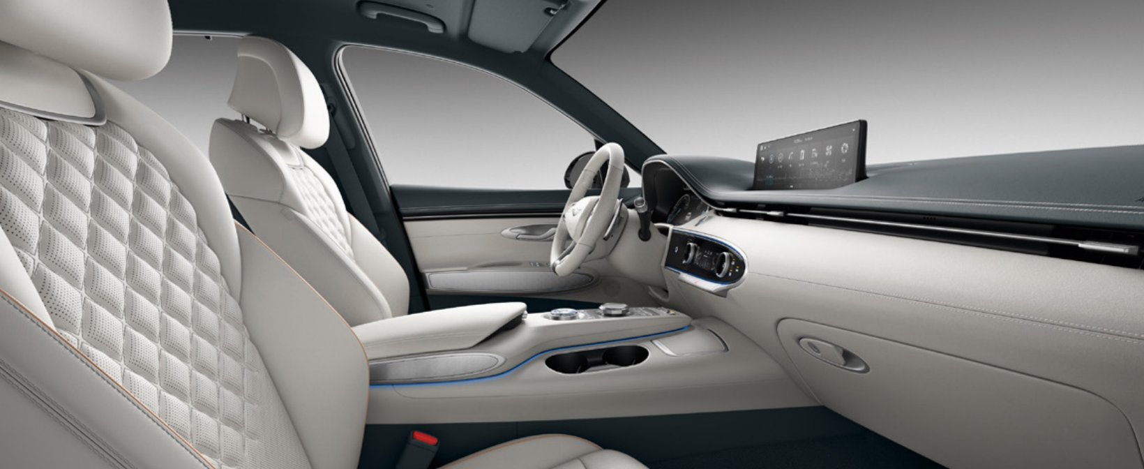 A photo of the interior of a Genesis GV60, showcasing the light-colored leather seats, a black dashboard with a large touchscreen display, and a leather-wrapped steering wheel.