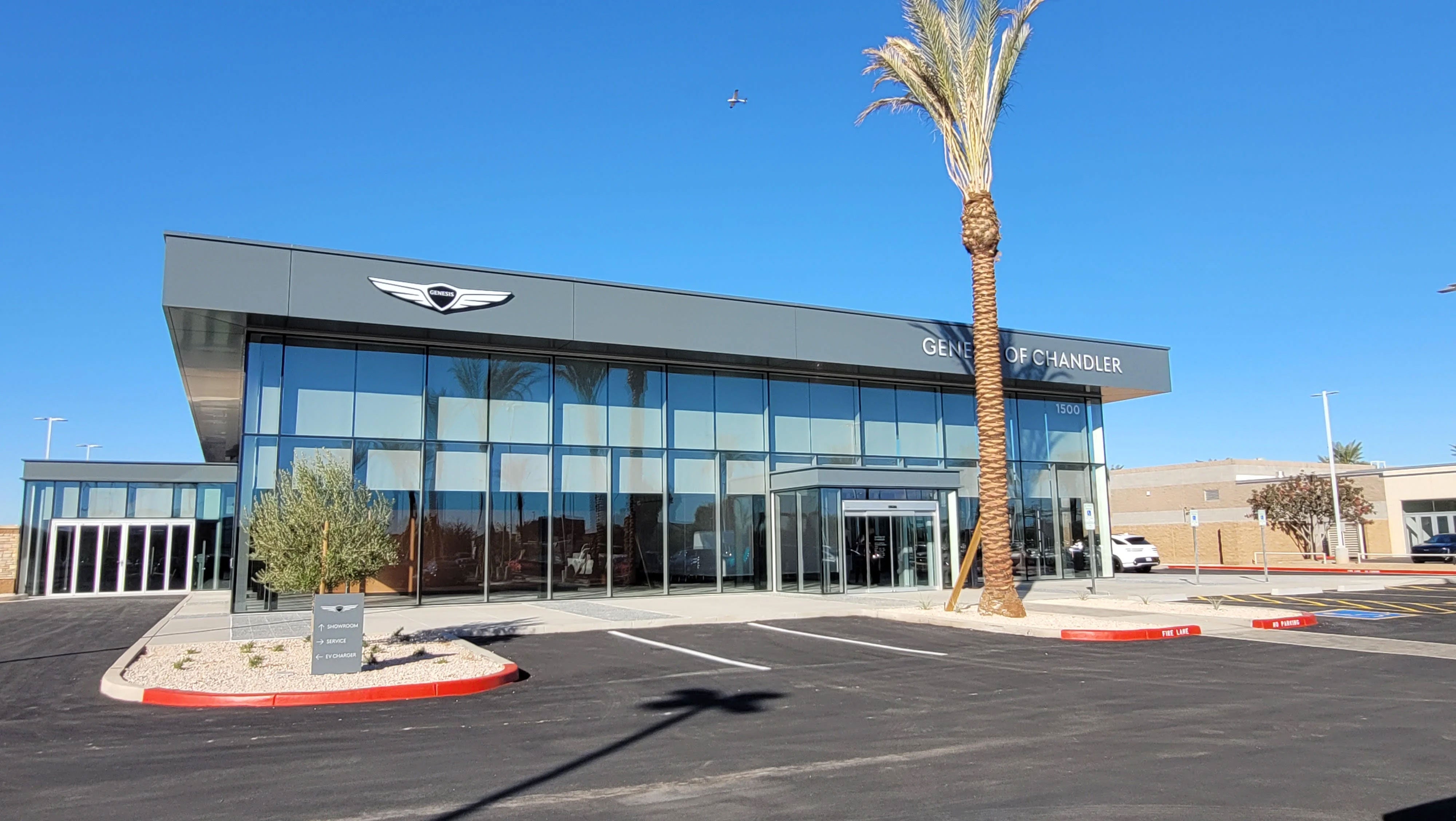 The front entrance to the Genesis of Chandler car dealership and service center.